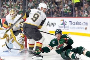 Matt Boldy, of the Wild, is tripped up in front of Vegas center Jack Eichel during Thursday night's 5-2 Wild victory at Xcel Energy Center.